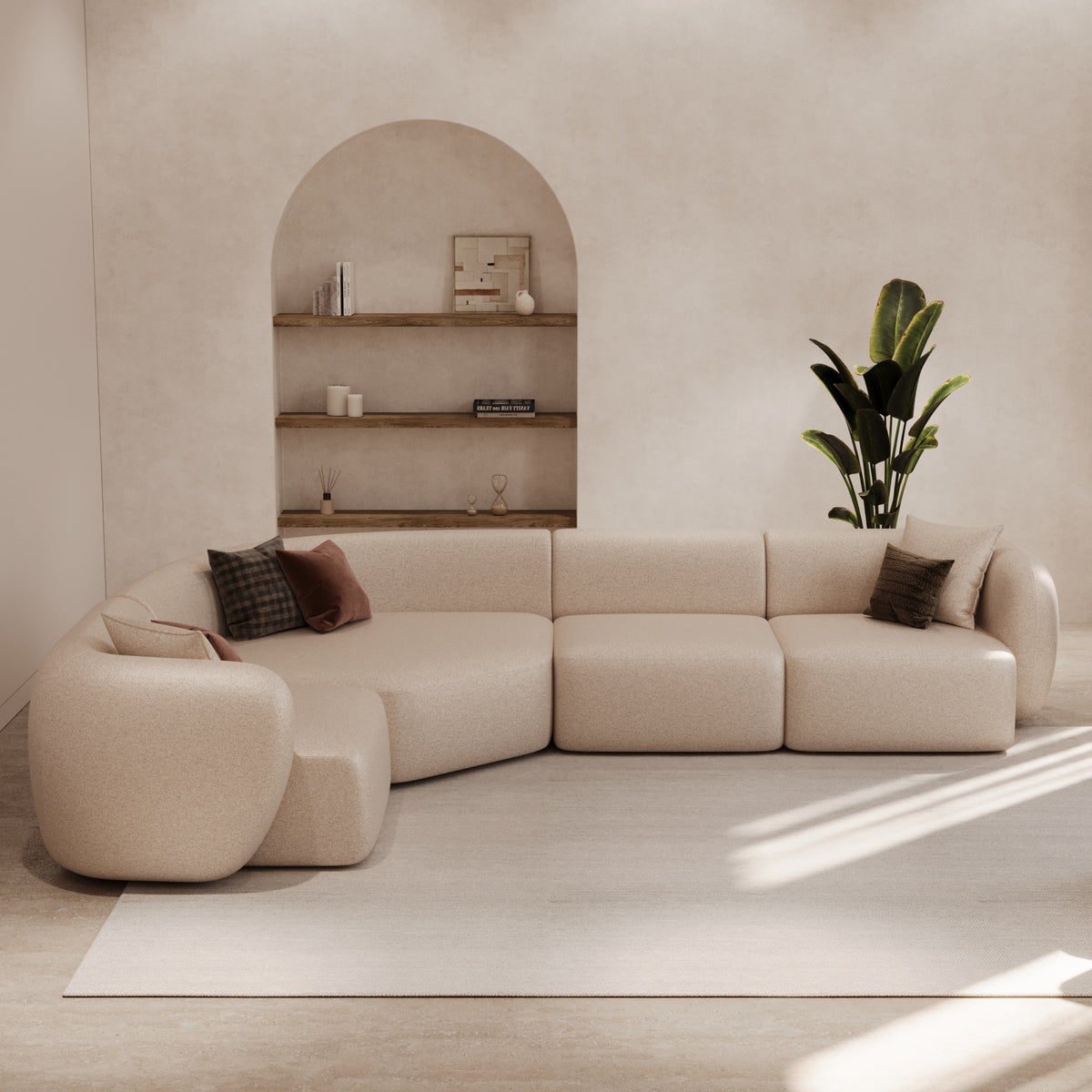 Curved modular sofa beneath an arched niche by The Gallery Home