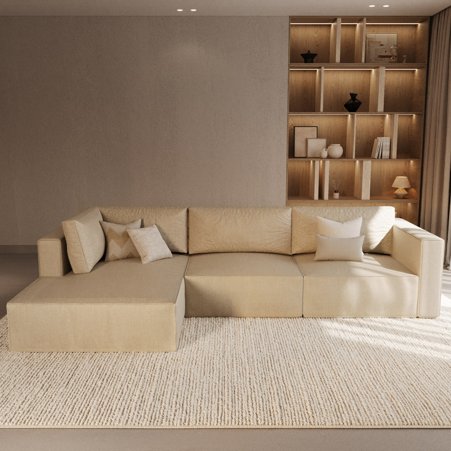 Corner sofa with chaise and lit shelving by The Gallery Home