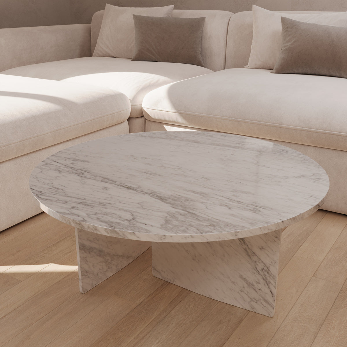 Dalia Carrara marble round coffee table by The Gallery Home