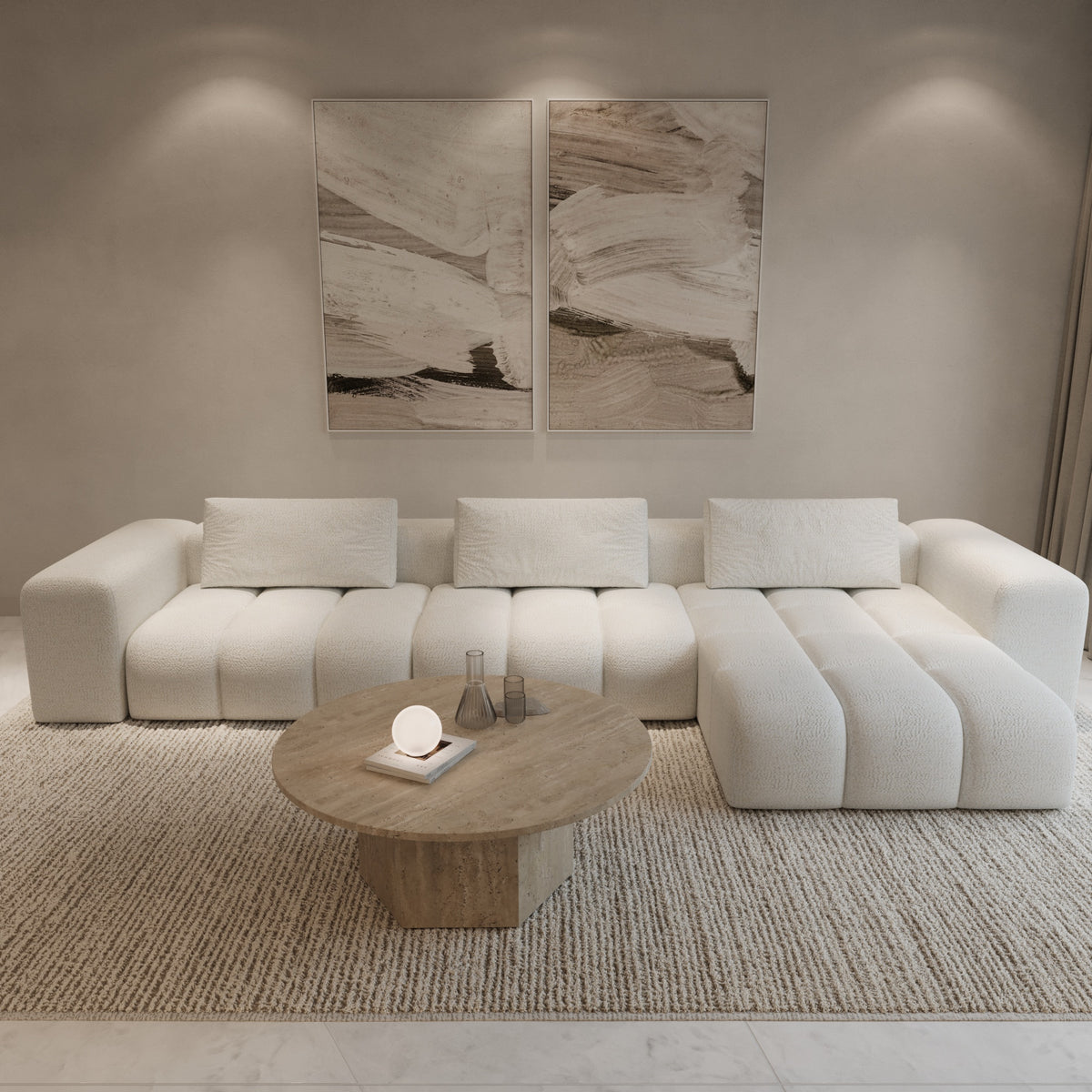 L-shaped boucle sofa with travertine coffee table by The Gallery Home