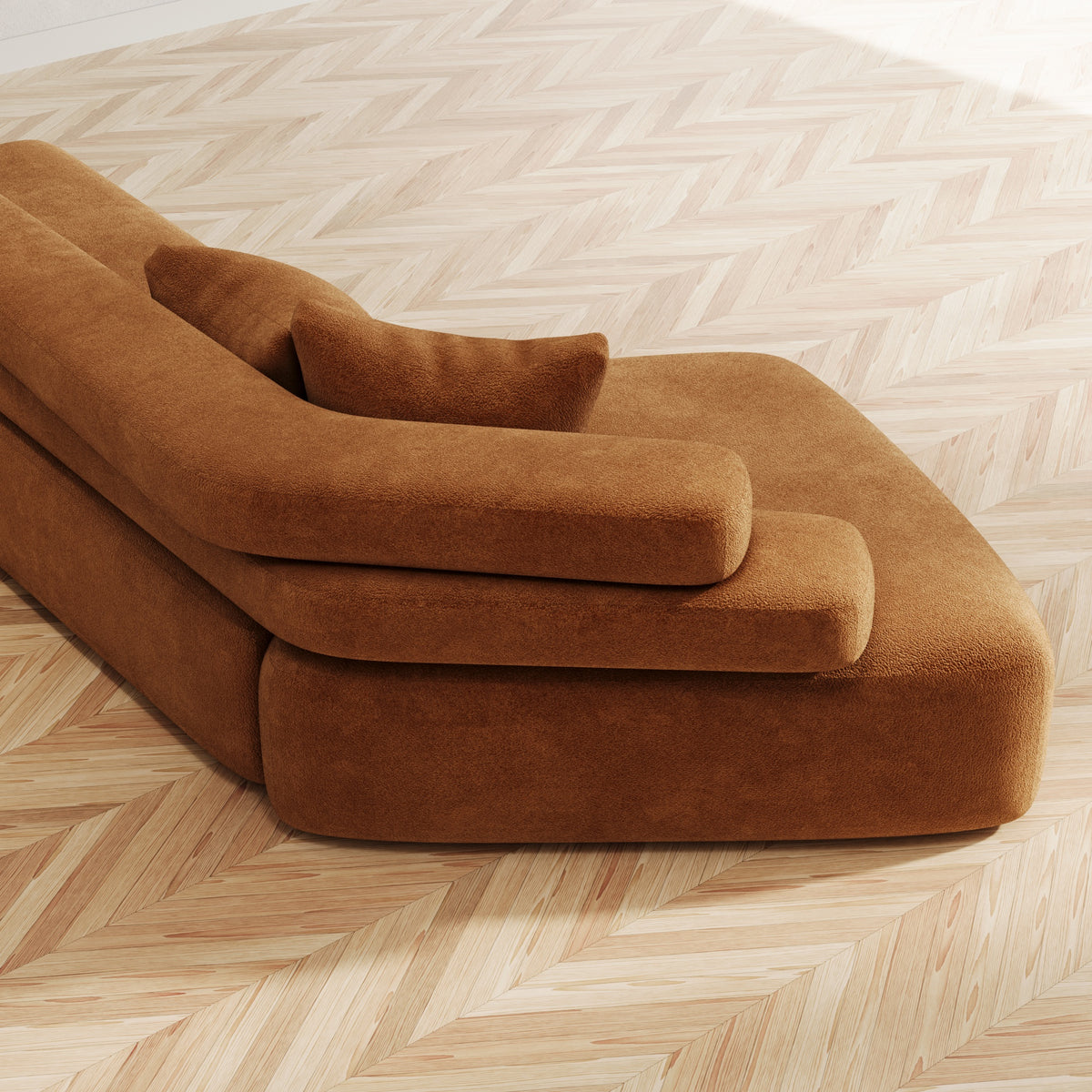 Close-up of a sculpted sofa in rich textured upholstery by The Gallery Home