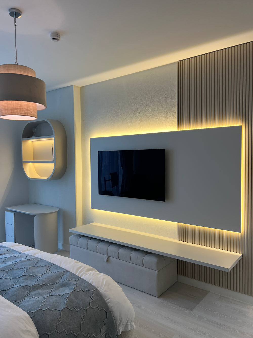 Bedroom media wall with fluted panelling installed by The Gallery Home